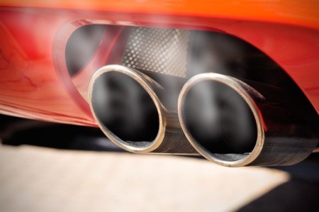 car dual exhaust pipe showing toxic gases